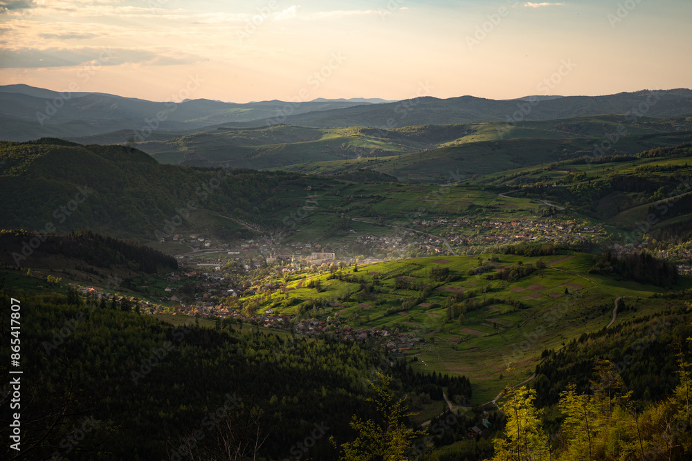 Fototapeta premium countryside area with rolling hills in carpathian mountains at sunrise. Borzhava range. Carpathian mountains, Ukraine