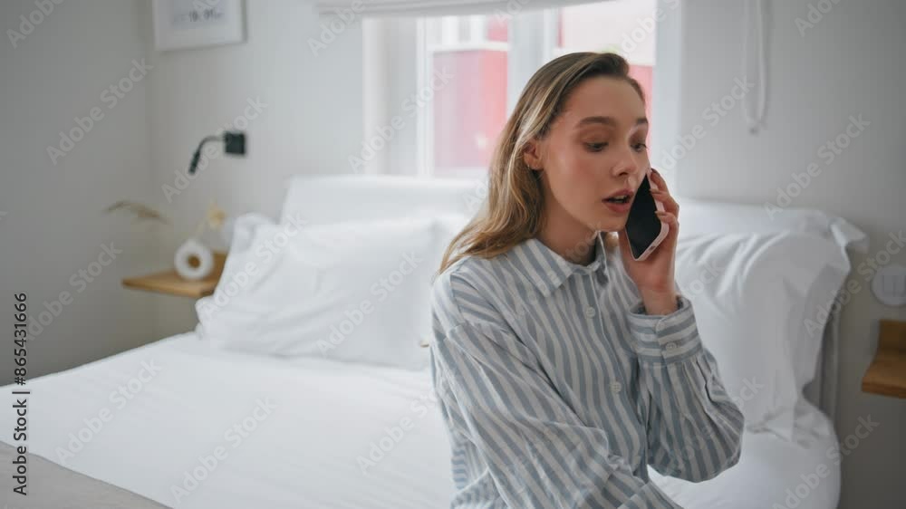 Relaxed woman answering call smartphone on apartment bed closeup. Girl talking Relaxed woman answering call smartphone on apartment bed closeup. Girl talking