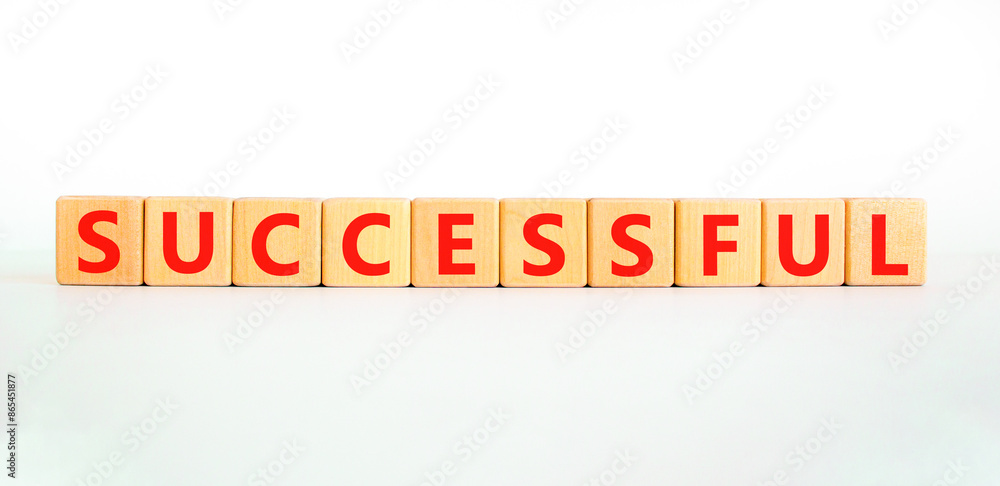 Successful symbol. Concept word Successful on beautiful wooden blocks. Beautiful white background. Business successful concept. Copy space. Successful symbol. Concept word Successful on beautiful wooden blocks. Beautiful white background. Business successful concept. Copy space.