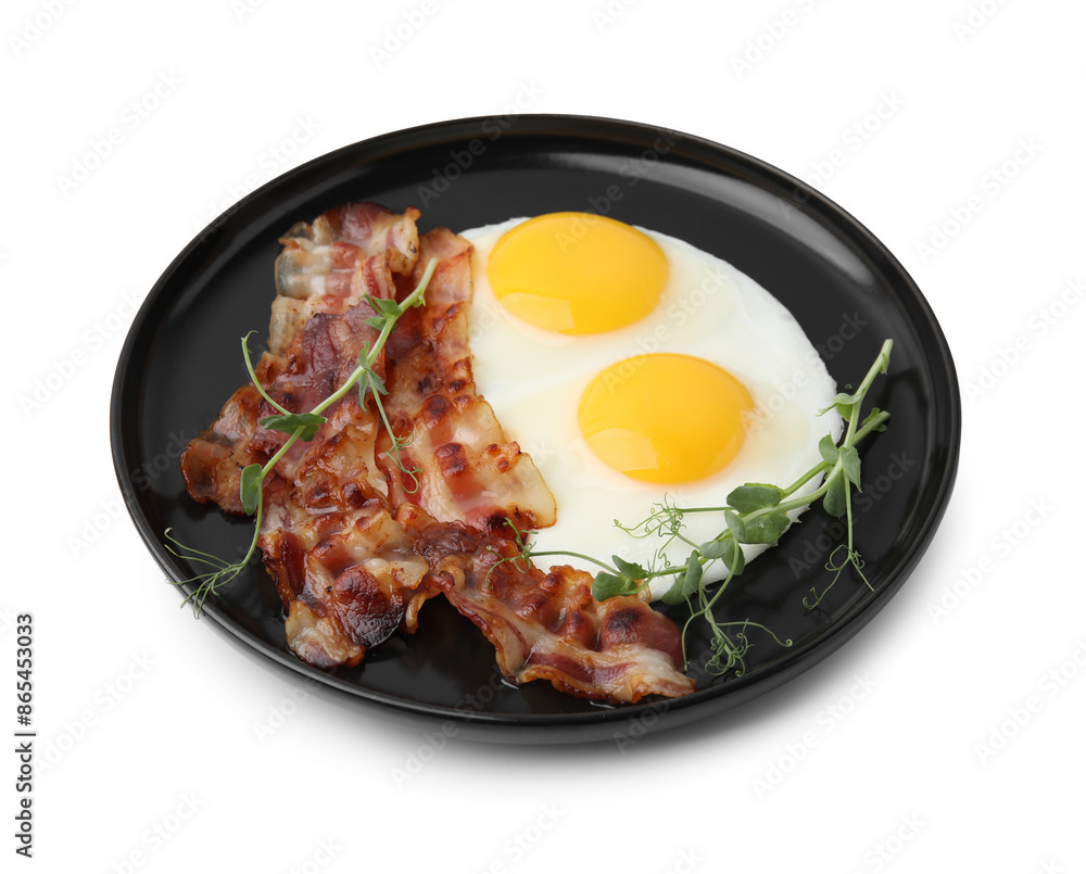 Fried eggs, bacon and microgreens isolated on white Fried eggs, bacon and microgreens isolated on white