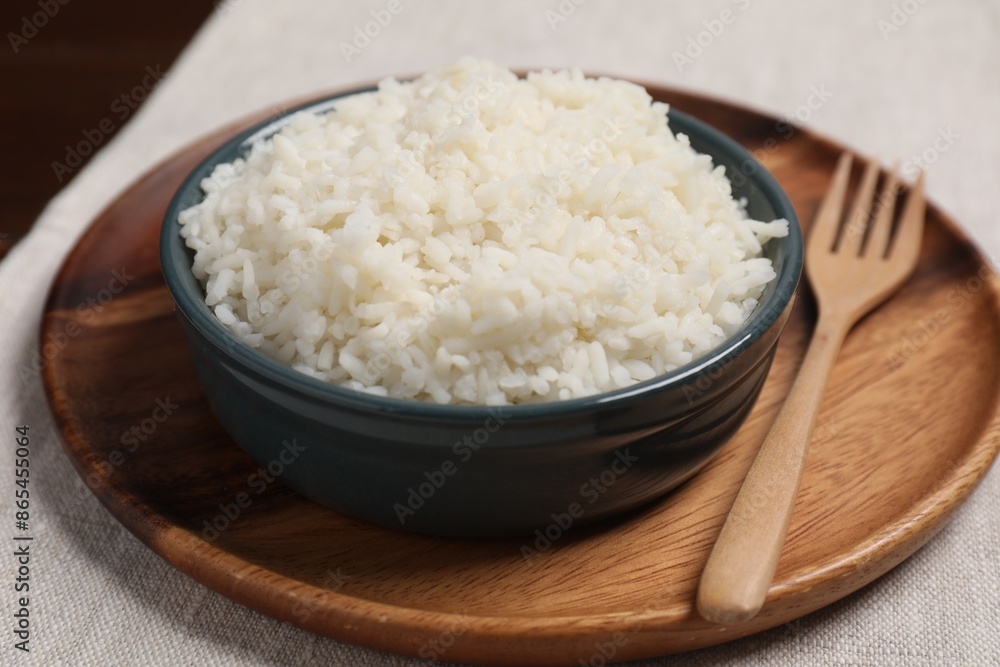 Delicious boiled rice in bowl on table Delicious boiled rice in bowl on table