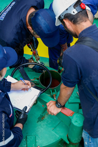 Ship refueling operation in port.