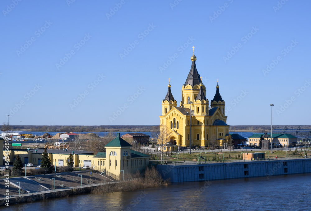 View of the Alexander Nevsky Cathedral and the bank of the Oka River in early spring in Nizhny Novgorod View of the Alexander Nevsky Cathedral and the bank of the Oka River in early spring in Nizhny Novgorod
