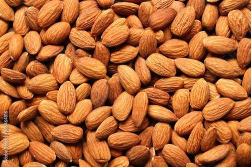 Creative layout made of almond nuts. Flat lay. Food concept. Almond pattern concept.