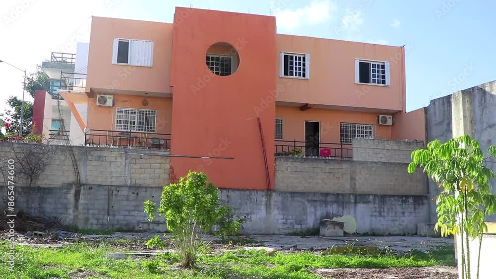 Orange buildings architecture hotels apartments palm Playa del Carmen Mexico. Orange buildings architecture hotels apartments palm Playa del Carmen Mexico.