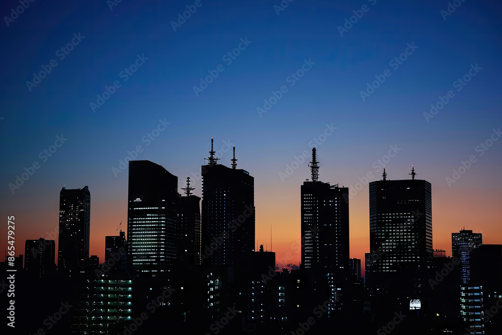 a city skyline with the sun setting behind it a city skyline with the sun setting behind it