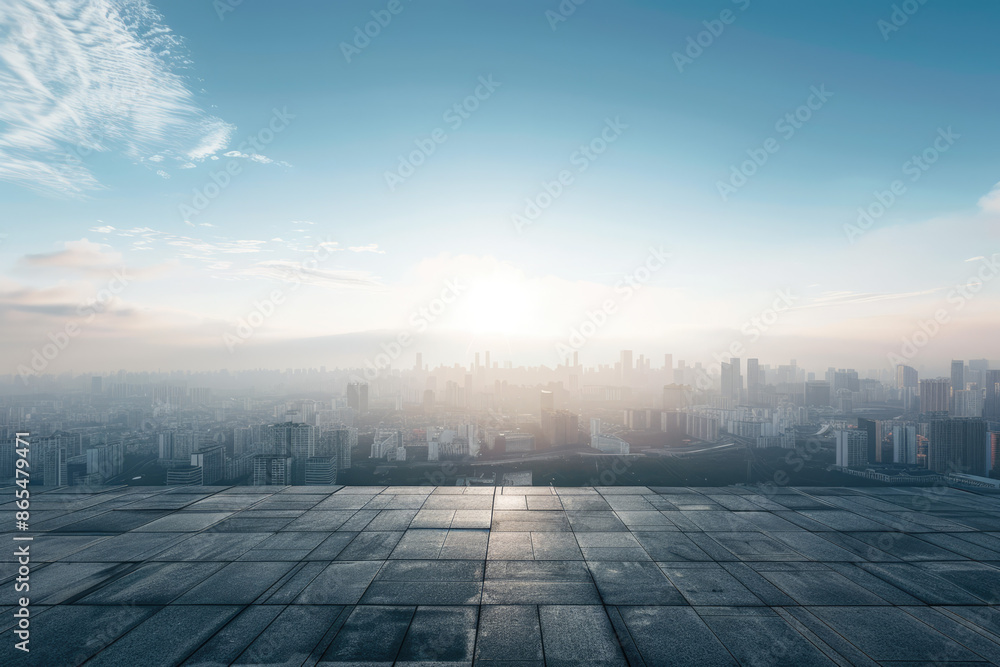a view of a city from a rooftop with a sun shining on it