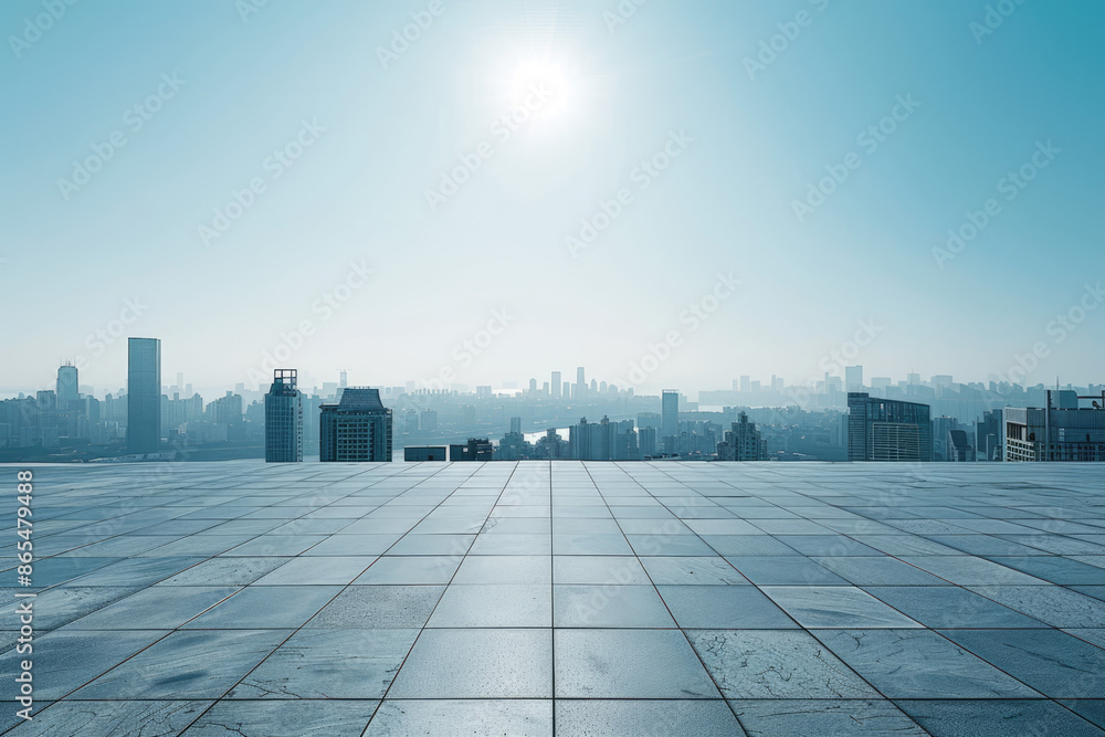 a view of a city from a rooftop with a sun shining on it a view of a city from a rooftop with a sun shining on it
