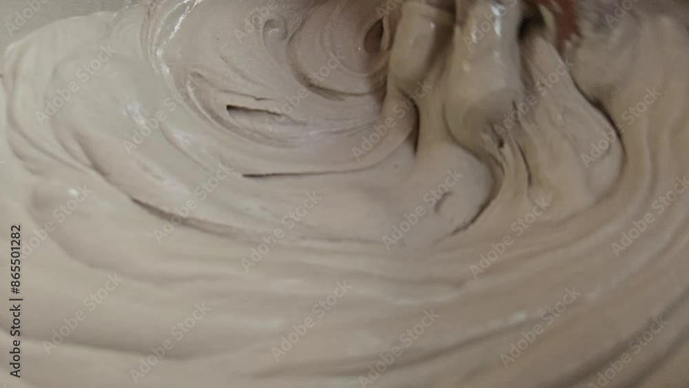Hand Of An Sculpture Artist Mixing Plaster Of Paris And Water In A Bowl To Make Plaster Mold, India Hand Of An Sculpture Artist Mixing Plaster Of Paris And Water In A Bowl To Make Plaster Mold, India