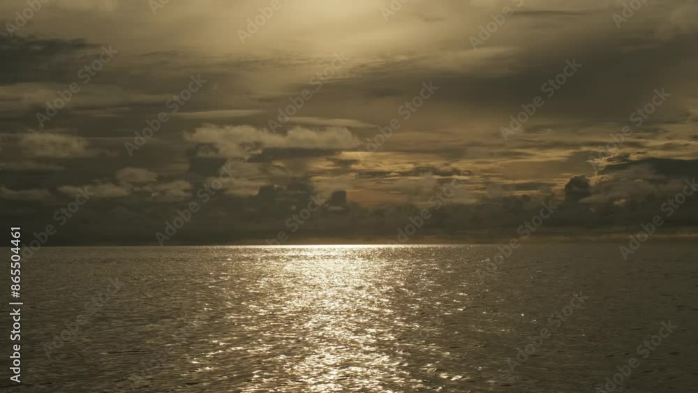 Calm waves of the sea during sunset. Beautiful pre-storm cloudy sky on the background. Calm waves of the sea during sunset. Beautiful pre-storm cloudy sky on the background.