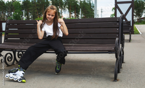 Happy little on the roller-skate in the park