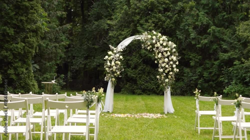 wedding arch of white rose flowers in the forest before the wedding ceremony of the bride and groom, festive romantic boho style decor wedding arch of white rose flowers in the forest before the wedding ceremony of the bride and groom, festive romantic boho style decor