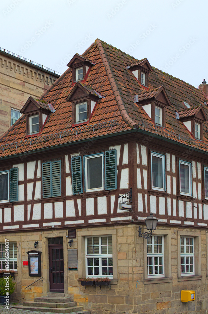 Picturesque street view of ancient house under red tile in the old town of Kronach. Typical architecture in Bavaria, region Upper Franconia, Germany. Travel and tourism concept Picturesque street view of ancient house under red tile in the old town of Kronach. Typical architecture in Bavaria, region Upper Franconia, Germany. Travel and tourism concept
