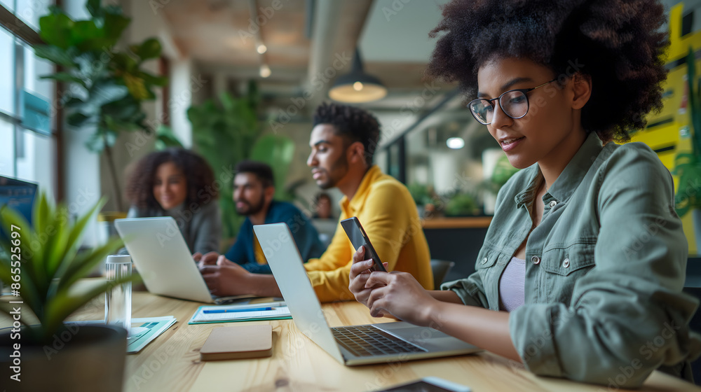 group of business professionals collaborating in a modern office space with laptops and smartphones, discussing strategies. group of business professionals collaborating in a modern office space with laptops and smartphones, discussing strategies.