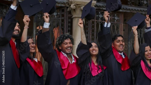 Indian students, wearing traditional academic gown, cap, celebrate academic achievement event.
