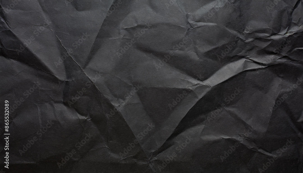 Fototapeta premium crumpled black office craft sheet paper, abstract minimalist luxury texture background wallpaper with space for copy and presentation, waste recycling