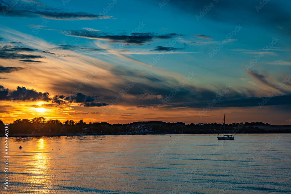 Naklejka premium Colorful sunset on the beach of Boltenhagen on the Baltic Sea