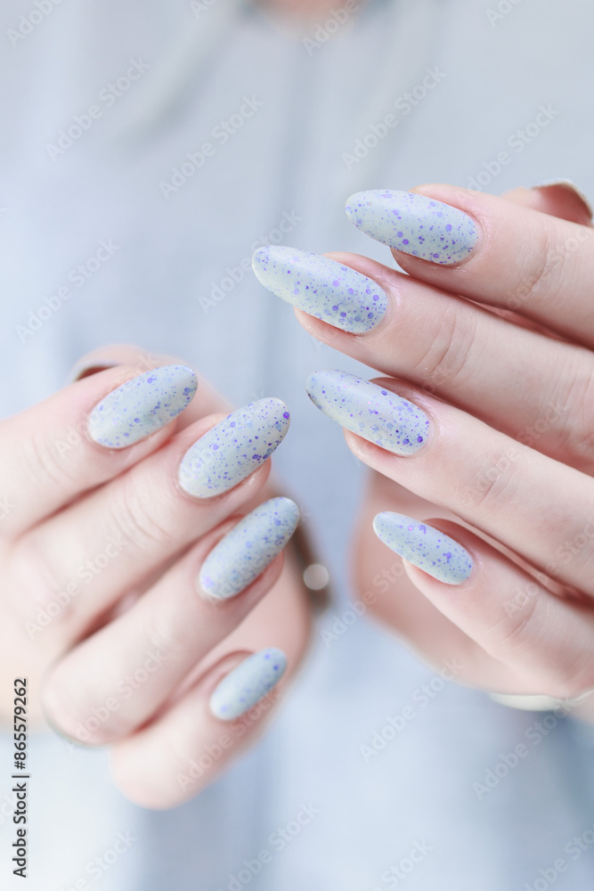 Female hand with long nails gray manicure Female hand with long nails gray manicure