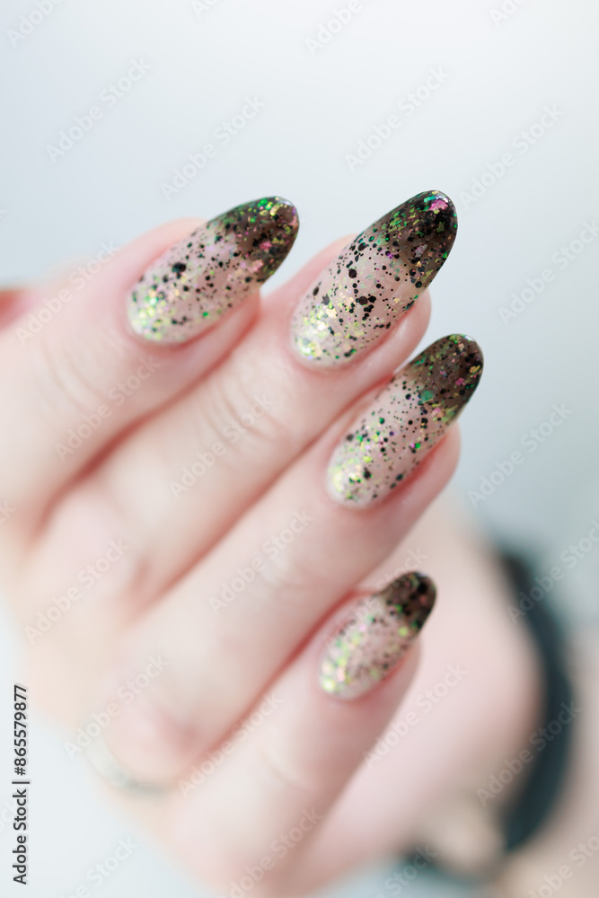 Woman's hands with long nails and white and black thermo manicure Woman's hands with long nails and white and black thermo manicure