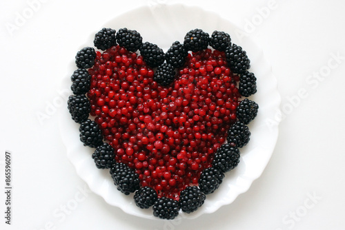red currants and blackberries in the shape of a heart