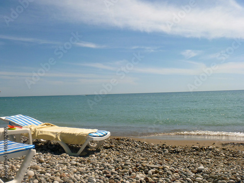 beach chairs and umbrella on the beach
