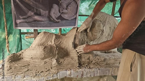 From Clay to Plaster of Paris mold- Indian Sculptor Artist Are crafting Plaster Of Paris Mold of a Dying warrior (fallen Trojan warrior, probably Laomedon) clay Sculpture..
 photo