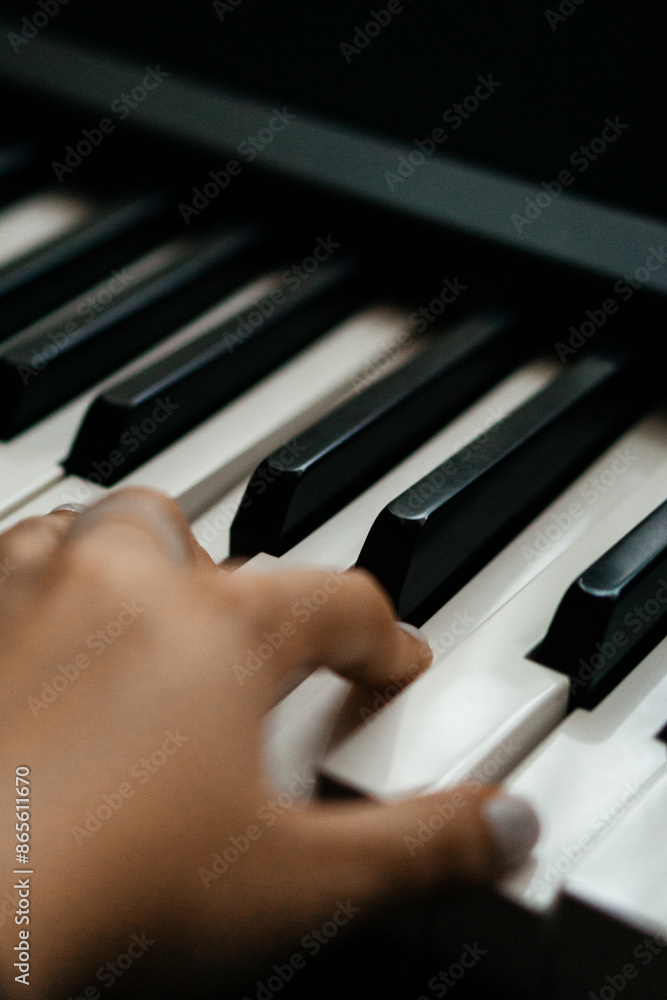 Fototapeta premium Piano keys person plays classical music black and white