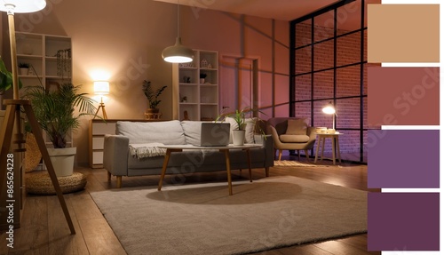 Sofa, table and glowing lam...