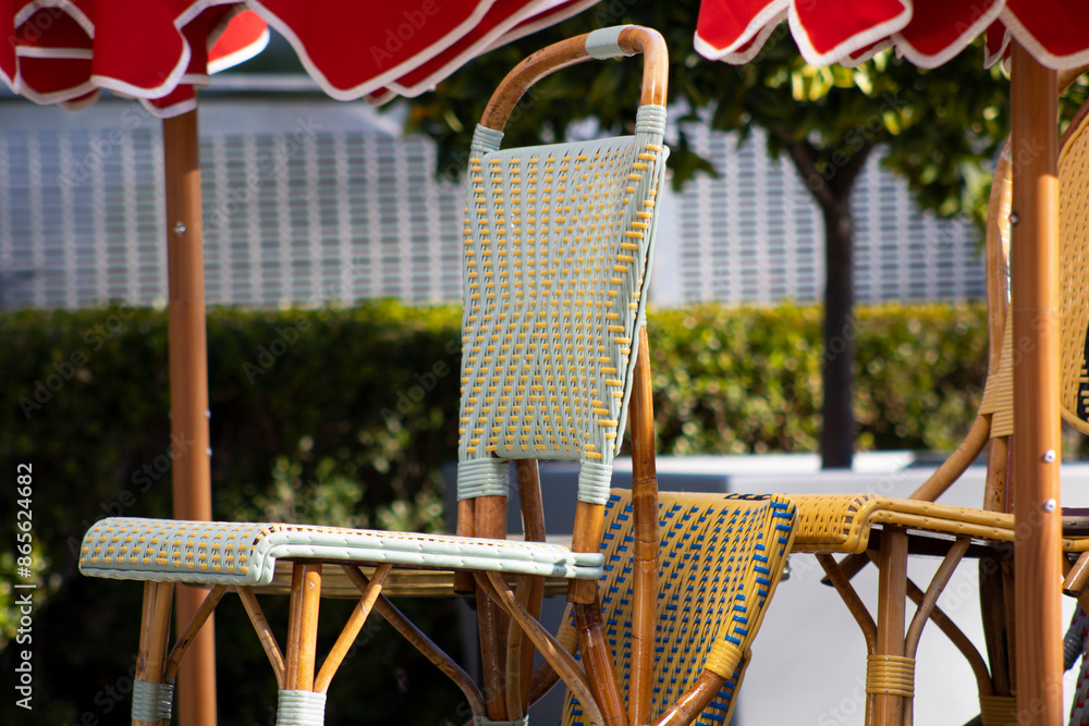 bistro chairs underneath red umbrellas bistro chairs underneath red umbrellas
