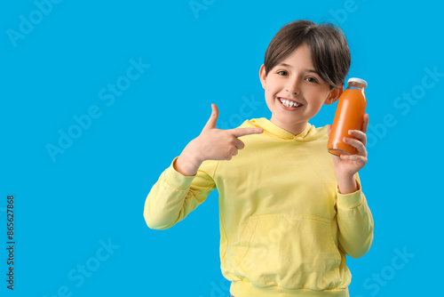 Little boy pointing at bott...