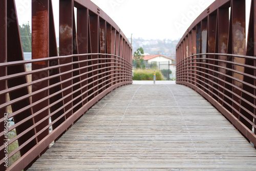 rustic wood and metal bridge in city