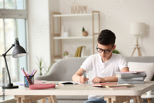 Little boy doing lessons at...
