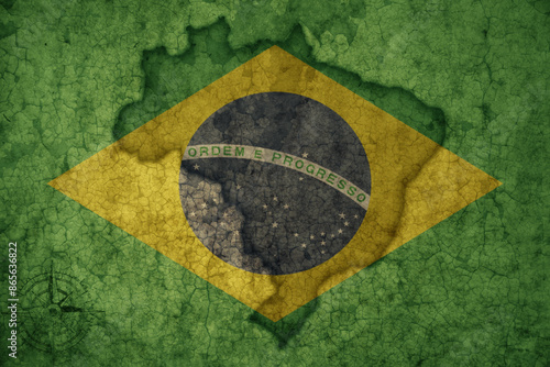 map and flag of brazil on a old vintage crack paper background .