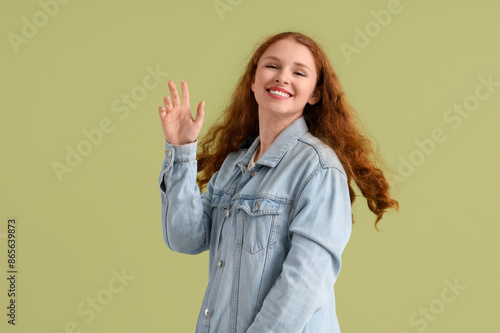 Smiling young redhead woman...