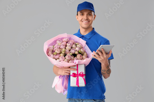 Male courier with bouquet o...