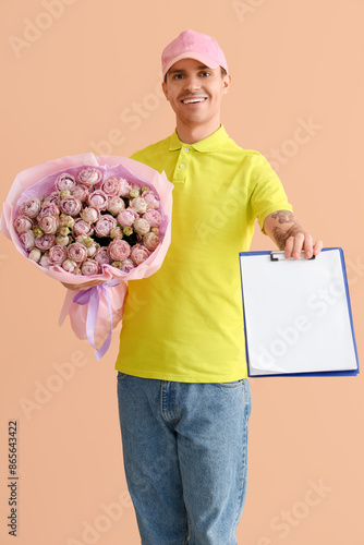 Male courier with bouquet o...