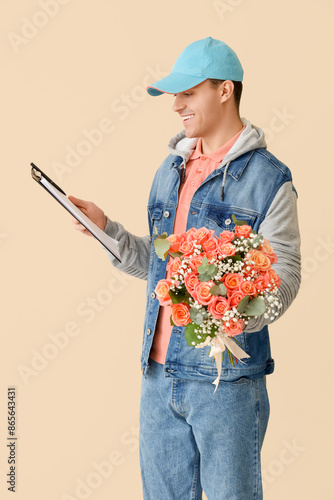 Male courier with bouquet o...
