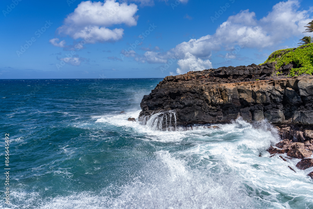 Waves hitting the Lava rock, Makahuena Light, Koloa, Kauai South Shore,Hawaii. Koloa Volcanics ,basalt Waves hitting the Lava rock, Makahuena Light, Koloa, Kauai South Shore,Hawaii. Koloa Volcanics ,basalt