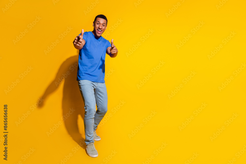 Full body photo of attractive young man point you proud dressed stylish blue clothes isolated on yellow color background Full body photo of attractive young man point you proud dressed stylish blue clothes isolated on yellow color background