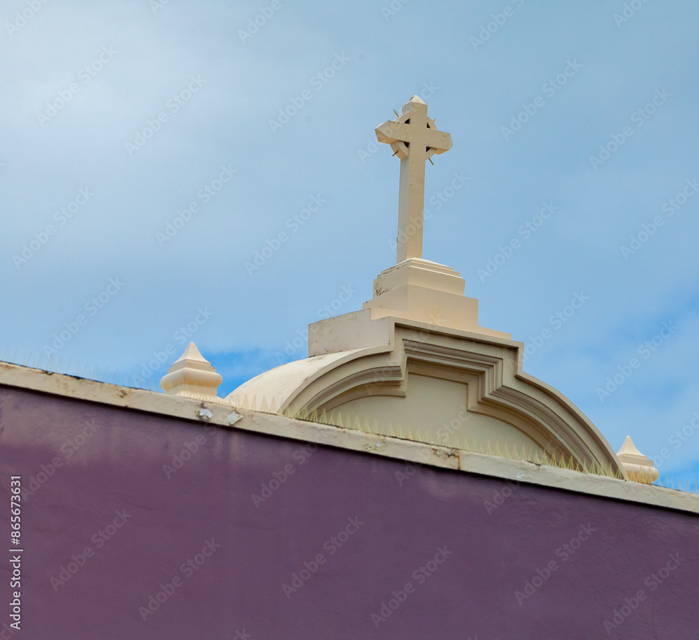 Yellow facade and cross of a church in old San Juan, Puerto Rico Yellow facade and cross of a church in old San Juan, Puerto Rico