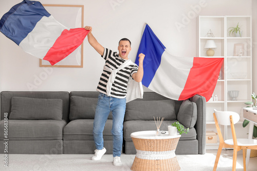 Happy young man with flags ...