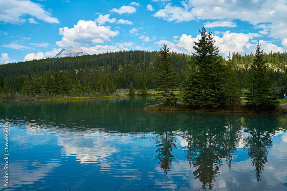 Incredible majestic mountains against the background of the beautiful turquoise Lake Minewanka in Banff National Park in Canada Incredible majestic mountains against the background of the beautiful turquoise Lake Minewanka in Banff National Park in Canada