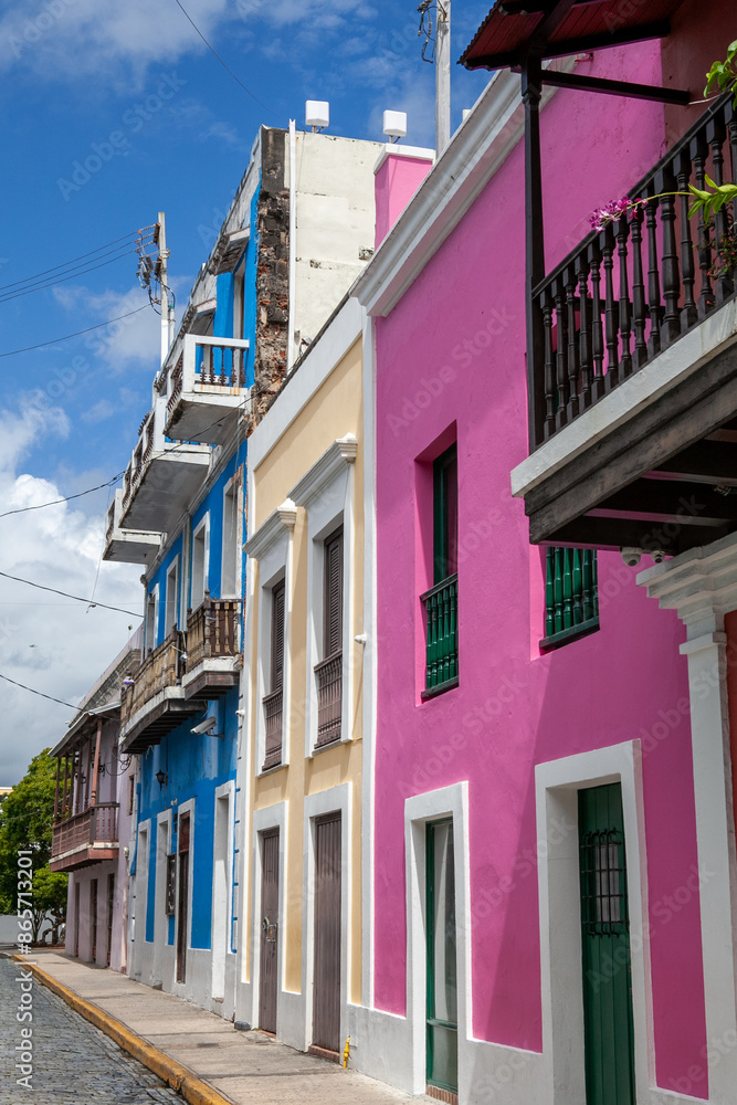 Naklejka premium Colorful house facades on cobbled street in historic Old San Juan, Puerto Rico