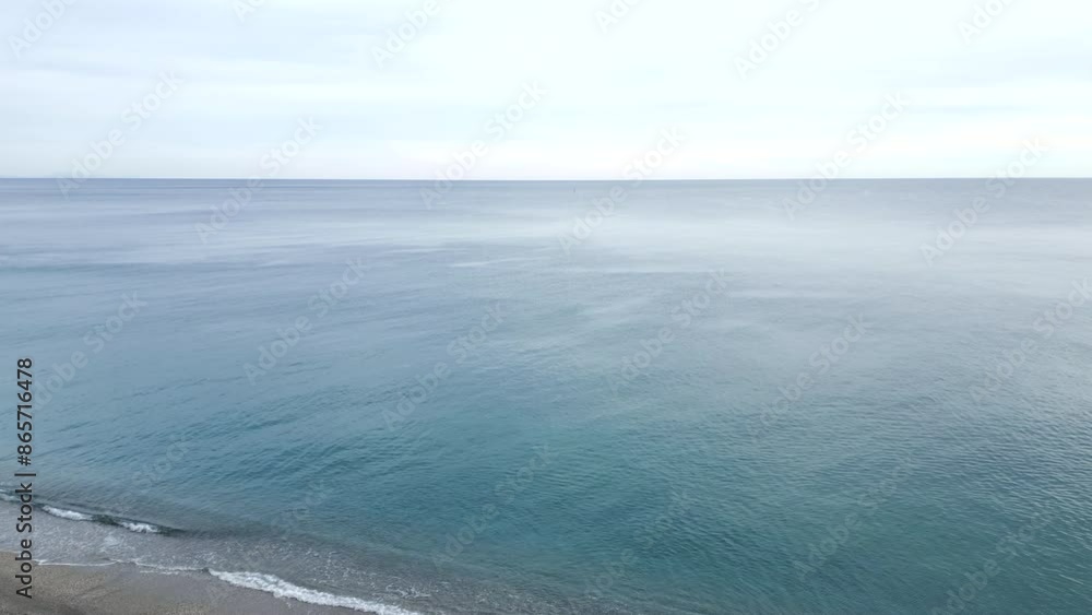 Drone flying over the French coast on a cloudy day where only two fishermen are there Drone flying over the French coast on a cloudy day where only two fishermen are there