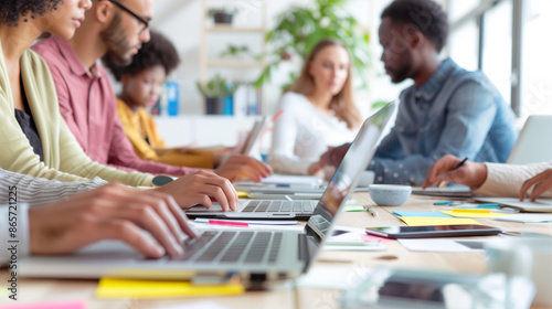a detailed image of an inclusive meeting with a diverse team using laptops and tablets, working together on a project, Diverse and Inclusive Work, Multiracial Group, Community, Off