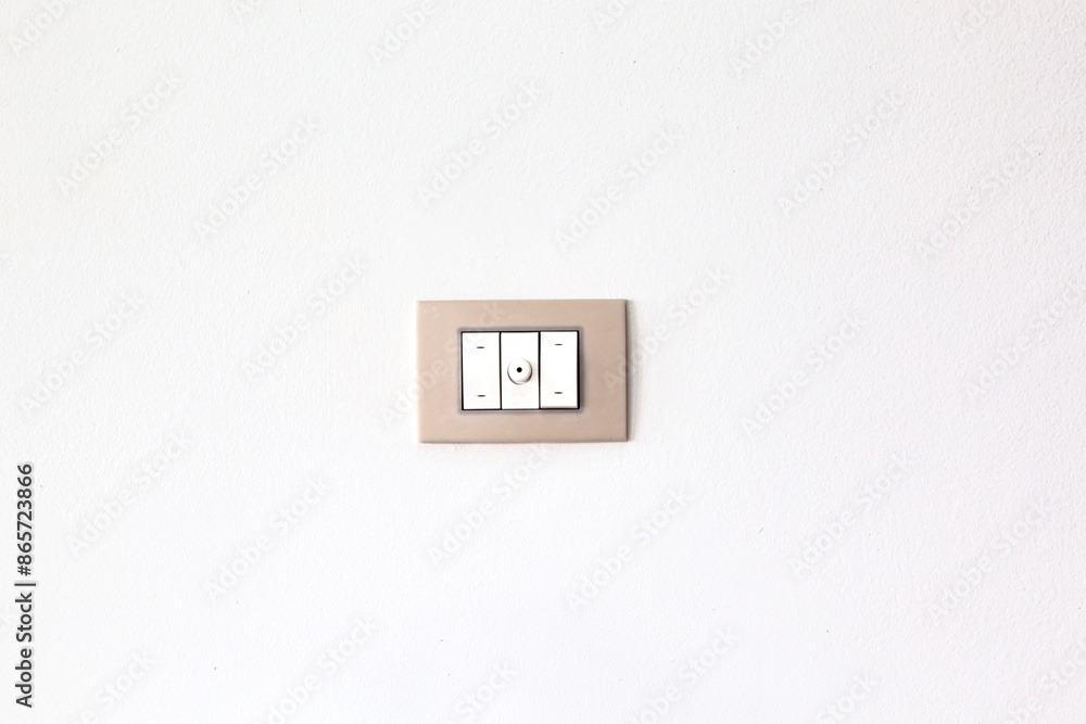 European style wall light switch on a white background. Three sections and dimmer control. Space for copying European style wall light switch on a white background. Three sections and dimmer control. Space for copying