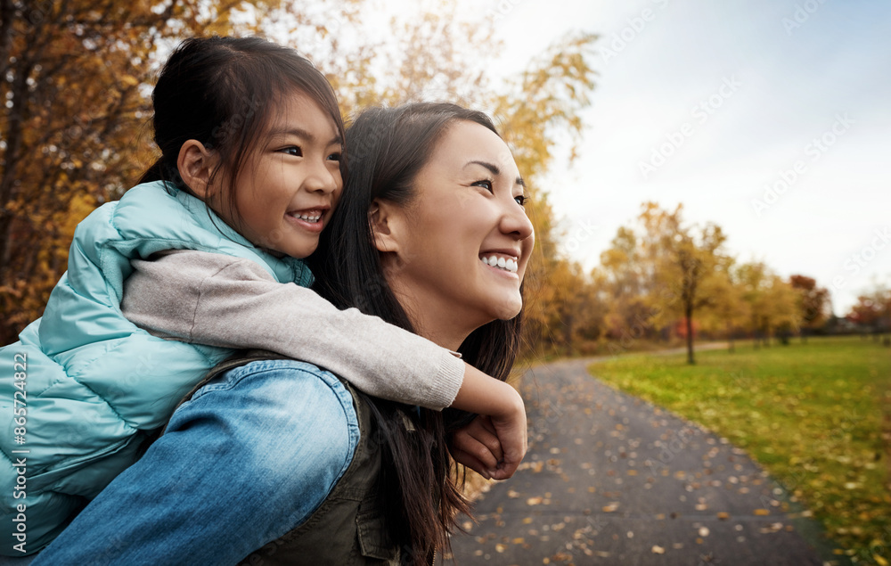 Mother, child and piggyback outdoor in autumn for bonding, love and happiness together in nature. Woman, girl and relationship at garden as family with back ride or smile for fun, freedom and playing Mother, child and piggyback outdoor in autumn for bonding, love and happiness together in nature. Woman, girl and relationship at garden as family with back ride or smile for fun, freedom and playing