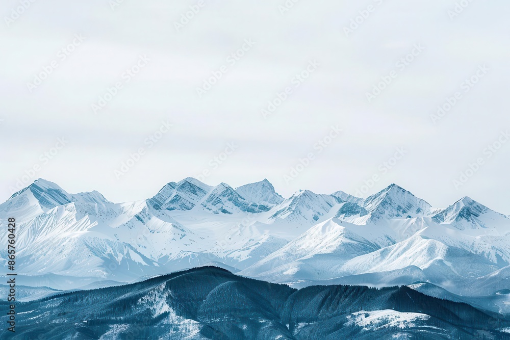 majestic winter mountain range panoramic view of snowcapped peaks stretching across the horizon their jagged silhouettes etched against a crisp pale winter sky majestic winter mountain range panoramic view of snowcapped peaks stretching across the horizon their jagged silhouettes etched against a crisp pale winter sky
