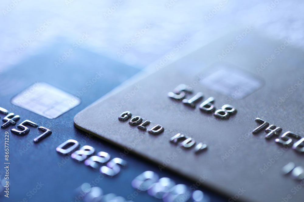 Plastic credit cards on table, macro view. Color toned Plastic credit cards on table, macro view. Color toned