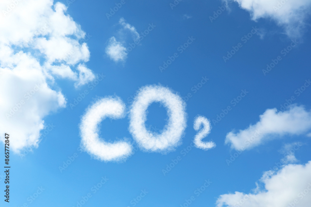 Blue sky with CO2 chemical formula and clouds. Carbon dioxide emissions Blue sky with CO2 chemical formula and clouds. Carbon dioxide emissions